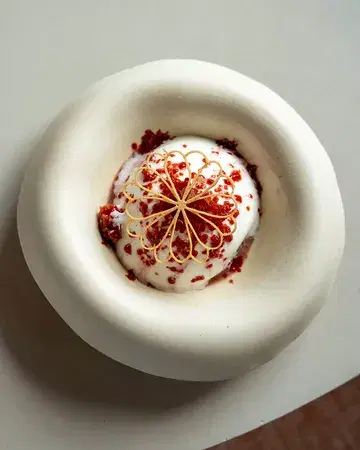 Cherry, kefir & tagetes 🍒 A vibrant dessert from our previous menu, celebrating the work of our trusted producers @stephanelonglune, @capucineatable and @herbea.bxl.