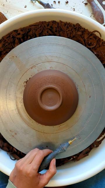 I am currently making tiny test bowls - again!- in this dark stoneware that I haven't used since 2020 (PRNI from @sio2.clay which I used back in Barcelona).
As you can see, I started on these in the summertime. 
I am stuck & need your help, if anyone has tips!

I encounter several issues:
1. The clay composition seems to have changed between 2020 & 2025. 
The colour, raw, is really different!
Is the final colour affected ?
I obviously started with stock from 2020, then had to move on to the new one. 

2. If the clay composition has changed, I guess that all the glaze tests I have been doing on the previous clay won't be useful on the new one... 

3. The clay bubbles heavily with some glossy glazes, I have tried several recipes and I am looking for a glossy, dark green, showing the clay underneath. 
Zinc free, no fritte, if possible.
I would like to stick to my no chrome, no cobalt, no nickel policy.
Happy to do an exchange for another glaze recipe (hoping to find the same raw materials here) in DM. If you're not sure, then just don't send me on the wrong path 🙏🏻

4. This clay doesn't like heat! Max 1240° C? Would it stand cone 7 or is cone 6 safer?
I have to change my firing curve and it makes it so tricky to fire with my other works. 

Any tips are welcome, I have been working on this order for months, it's a really small restock and I don't see much progress.
I have made hundreds of pieces with this clay in the past, but it was over 5 years ago...
.
The bowls are for lovely people, whom I feel aligned with, for a restock. I would love to be able to finish this order soon. 
Otherwise, I don't use this Spanish clay anymore, it means a lot of research for a rather small project. 
.
It's smooth to throw, allowing me to make really thin and elegant works, but I won't use it anymore afterwards. 
And obviously, I bought only the supply required for this order as I didn't expect so many failures, so I'll probably have to order some more. 💪🏻🙃
.
Tips, advice or just a warm 