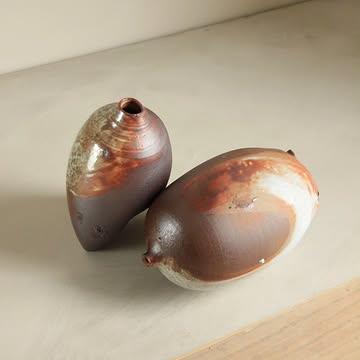 Collapsed vessels, once full of purpose.
.
These vases stood tall on the top shelf in @legrosarlette's wood kiln last October.
Now, they're fragile, moving ceramics. 
The textures and ash deposit are subtle, the sharp, paper thin materials too. 
How would you display them, on a wall? In a garden?
.
In a recent wood firing, I have placed 4 vessels in the same clay, trying to keep them a little thicker, and I don't know yet if they are still standing or not. If they could withstand the power of the flames. 
.
Not related: I am sending the 1st newsletter of the year tomorrow, you're still on time to subscribe on the website. Link in bio. 
.
.
.
#woodfiredceramics #gresdetreigny #fragility #artsandcrafts #shibui