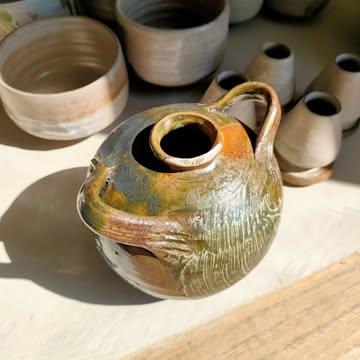 We're almost mid-May but here are a few highlights of April.
I am sorry for not posting more regularly here, it's been intense. 
.
My little joy's:
1. An oribe with hakeme glazed bud vase ~ it's asking for a hug, right?
2. Sharing soup with Tokyo 🐾 on a sunny day
3. Restocking glazes with the best 🐶
4. Playing Tetris with green ware 
5. All fit in the Méphistophélès @artmarottebe
6. Tetris again, with @charles_bottin_ @fabiennewithofs @frederic_mathieu_ceramiste 
7. Sunset in Braives
8-11.🔥🔥🔥 ~ 1st firing of this new wood fired kiln @artmarottebe
12. Wood fired magic 🍶✨
13. A shino glazed chawan & hay ash drip 💚 gifted by the fire. 
.
I also taught 2 weekends in a row to lovely people, finished  commissions for the kindest clients & prepared new pieces for Andenne Ceramics Market coming (very) soon.
.
By the way, should I include a small selection of wood fired pots to bring with me for this occasion?
Let me know what you think ! 💬