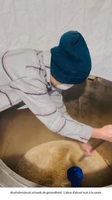 Farrell shows us the temperature meter as we mix the grains and water for the first time. This step, called ‘mashing,’ is where we extract the sugars that will eventually become our beer.