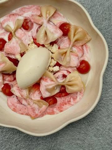 Yes, in Poland we eat pasta with strawberries for dessert and we’re doing just fine! 

It’s a beloved Polish comfort food, often enjoyed as a light lunch or dinner during strawberry season. This traditional summer dish combines cooked pasta with fresh strawberries and sour cream.

We decided to have some fun with the classic: homemade farfalle, smoked cream for depth, and a little pink pepper to keep things fresh and cheeky.

@iga.swiatek guess what? Your favourite summer pasta is here 🍓