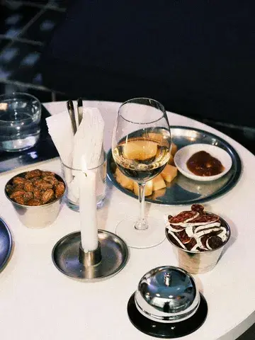 Candlelight.
Fine cheese.
Cured meat.
Good drinks to savour.

Need there be more?