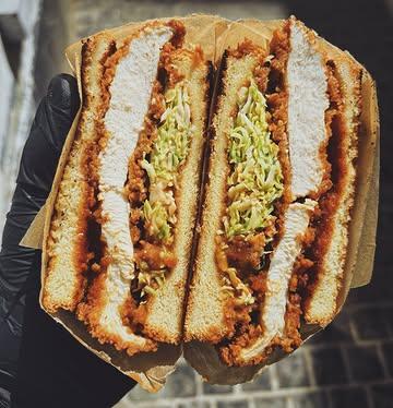 “Tonkatsu Sando. Our house-fried buttermilk chicken, homemade tonkatsu sauce, fresh green cabbage. Made with intention.“​​​​​​​​​​​​​​​​