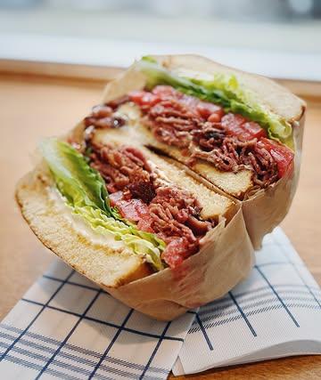 Our BLT Turkey sando is built with crispy turkey bacon, crisp romaine lettuce, and the star of the show — coeur de boeuf tomatoes Meaty, juicy, and packed with flavor like no ordinary tomato can touch.

This is what a deli sandwich is supposed to taste like.

100% halal!