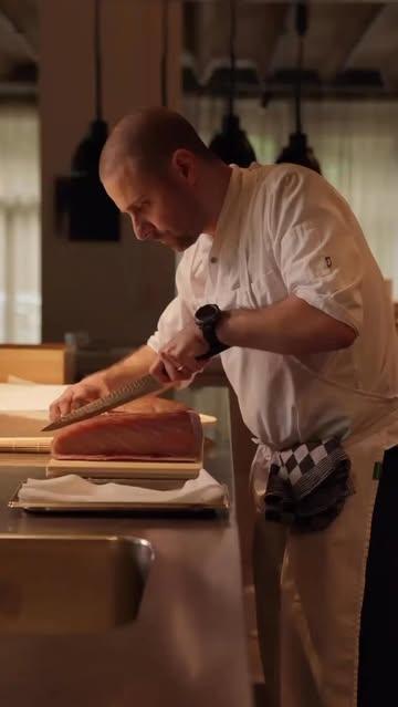 Chef Yves slicing tuna belly.