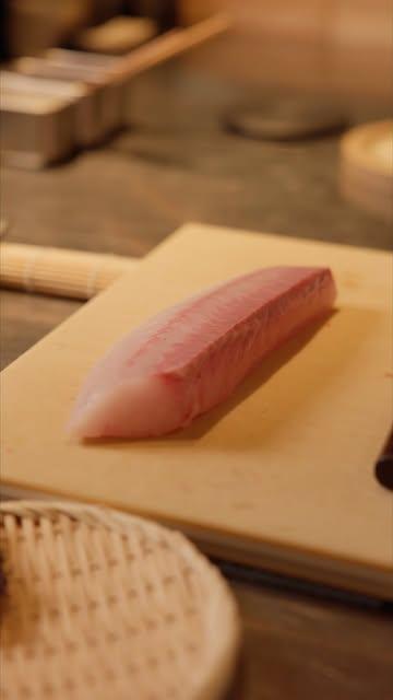 Chef Yves slicing hamachi.